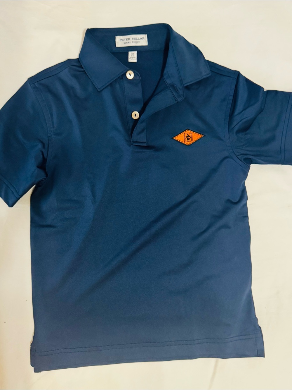Peter Millar Navy Polo with Orange Diamond Patch